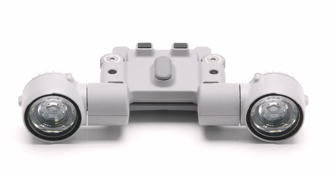 Front view of the drone spotlight module on a white background, showcasing its powerful lens and compact design for enhanced visibility in wildlife tracking and deer recovery operations.