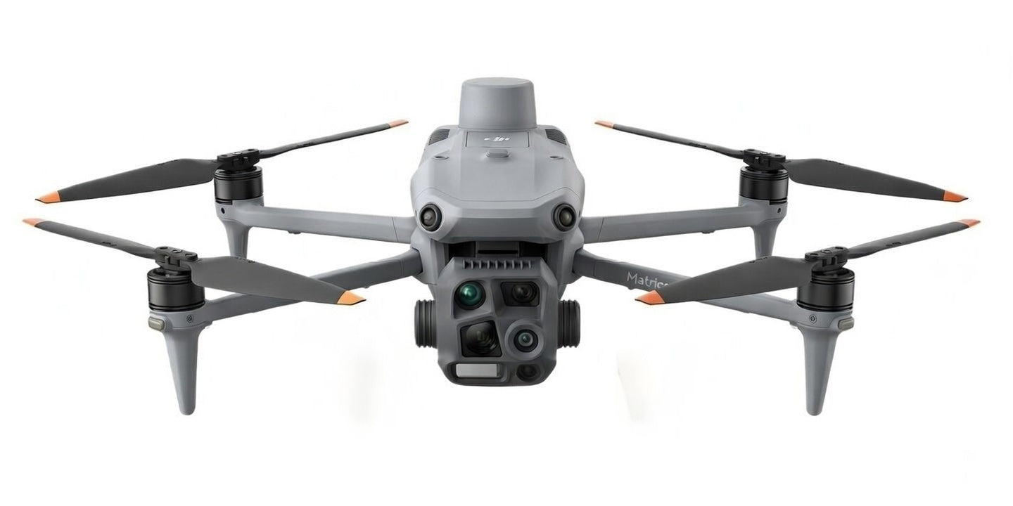 DJI Matrice 4T enterprise thermal drone front view showing five-sensor gimbal with 640x512 infrared thermal camera 48MP wide-angle 48MP medium telephoto 48MP telephoto with 112x hybrid zoom and laser rangefinder for inspection deer recovery and public safety from Covert Drones