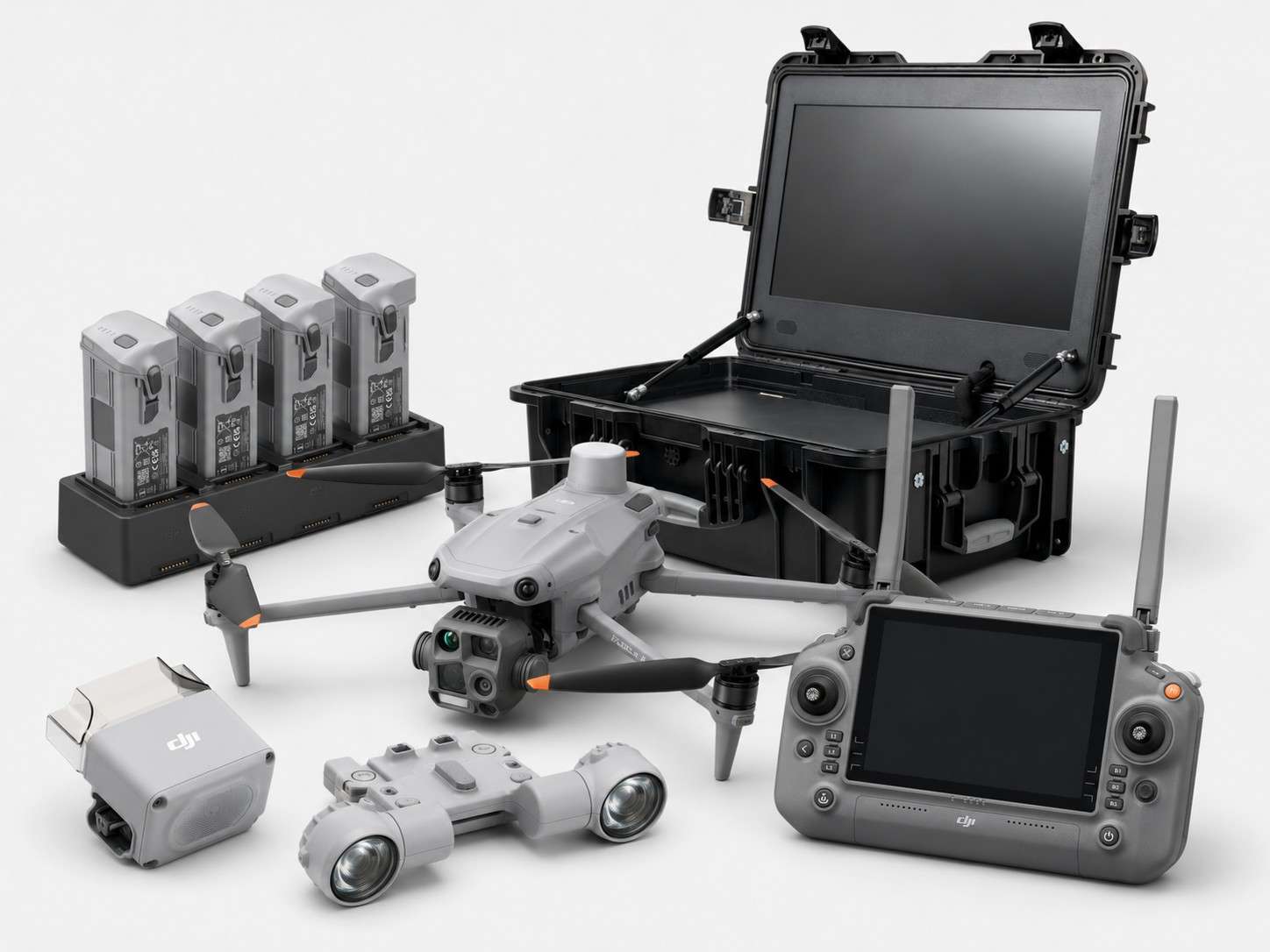 DJI Matrice 4T thermal drone bundle with spotlight, speaker, rugged monitor case, remote controller, four batteries, and charging hub.