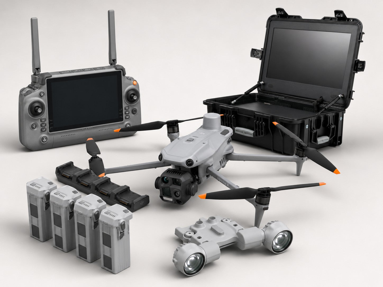 DJI Matrice 4T thermal drone bundle with spotlight, remote controller, four batteries, charging hub, and rugged field monitor case.