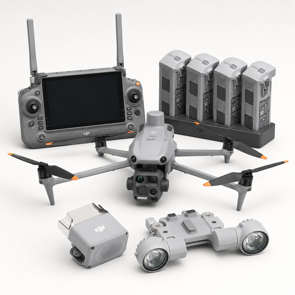 DJI Matrice 4T thermal drone bundle with spotlight, speaker, remote controller, four batteries, and charging hub on a white background.