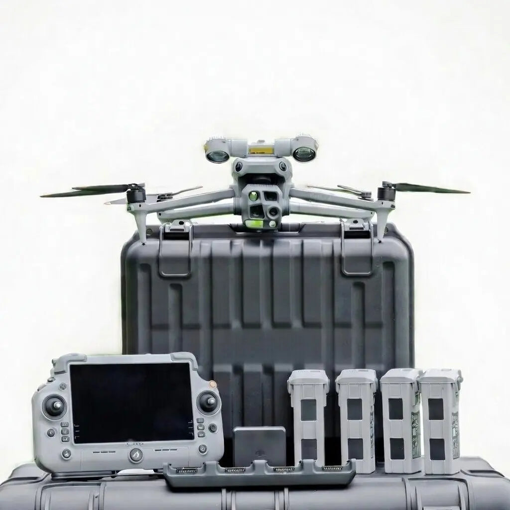 DJI Matrice 4T thermal drone sitting on hard case with RC Plus 2 controller and four intelligent flight batteries laid out for deer recovery kit from Covert Drones