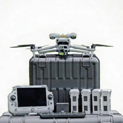 DJI Matrice 4T thermal drone sitting on hard case with RC Plus 2 controller and four intelligent flight batteries laid out for deer recovery kit from Covert Drones