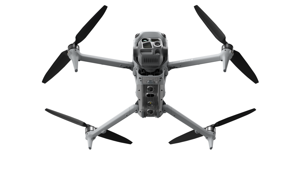 Bottom view of the DJI Matrice 4T drone on a white background, showcasing its landing gear and high-precision camera system for wildlife tracking and deer recovery.
